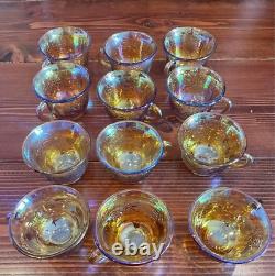 Vintage Carnival Punch Bowl & 12 Cups. Amber carnival glass reflective